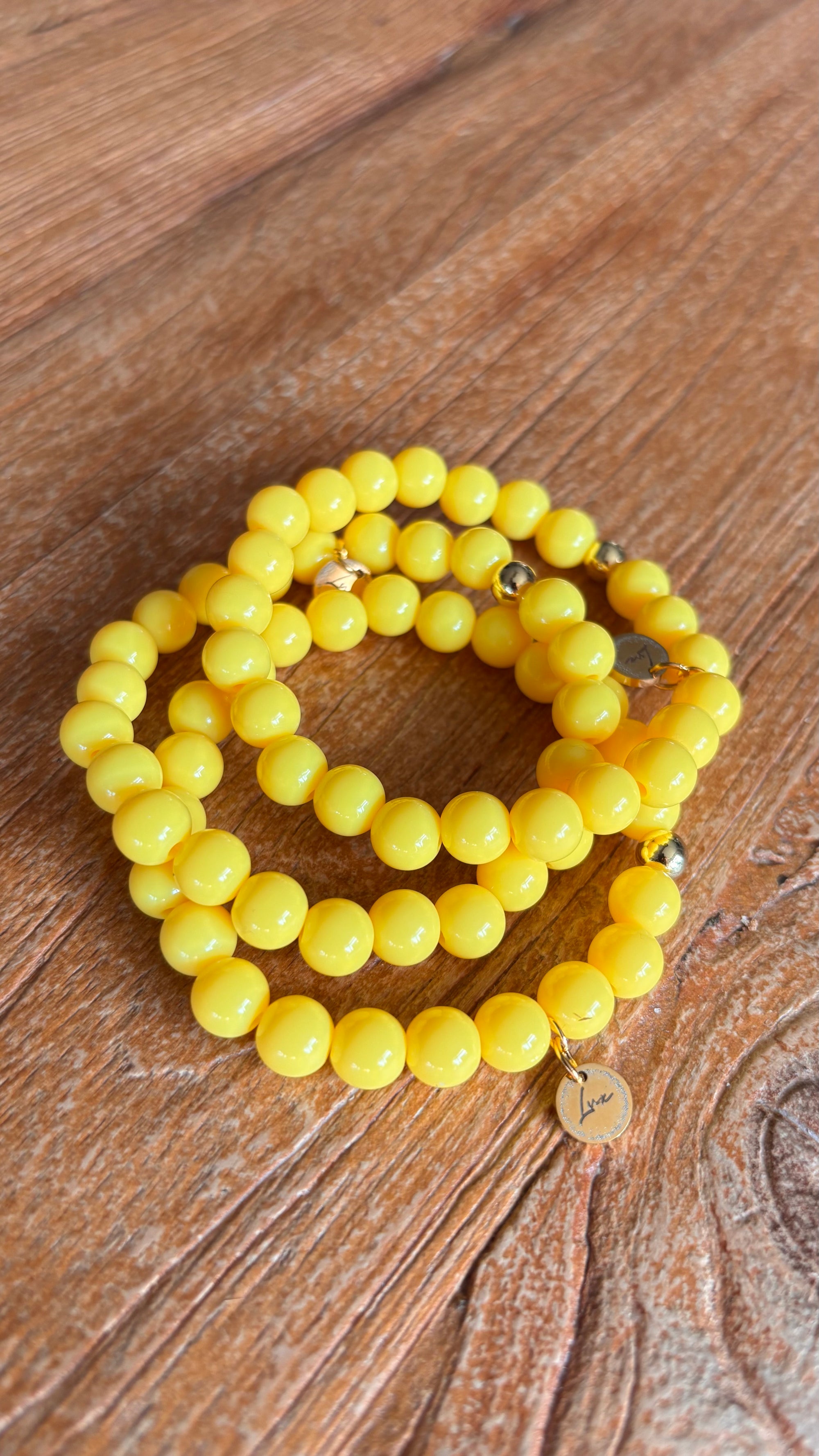 Stretch armband botergeel